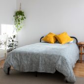 Bright minimal cozy interior bedroom with bed and table with mirror